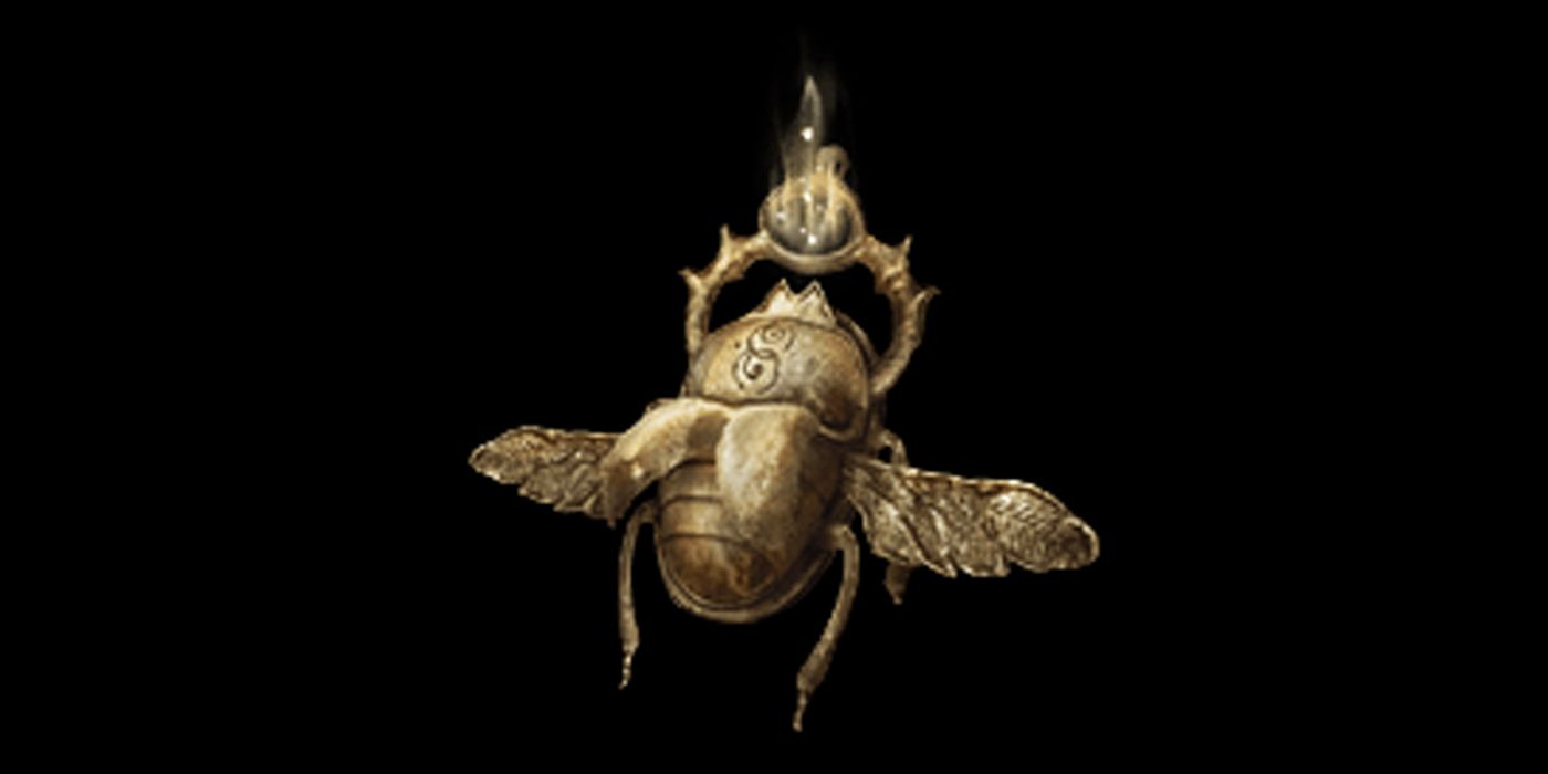 A golden scarab amulet that glows in the light of the Elden Ring.