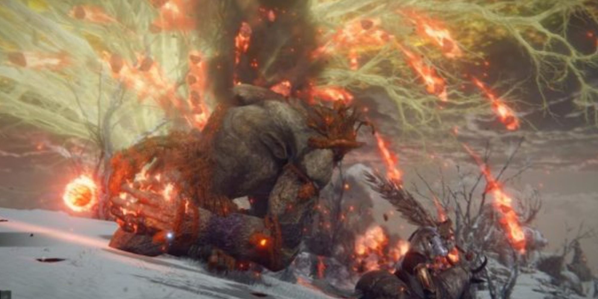The Fire Giant erupting a fury of molten rocks into the air in Elden Ring