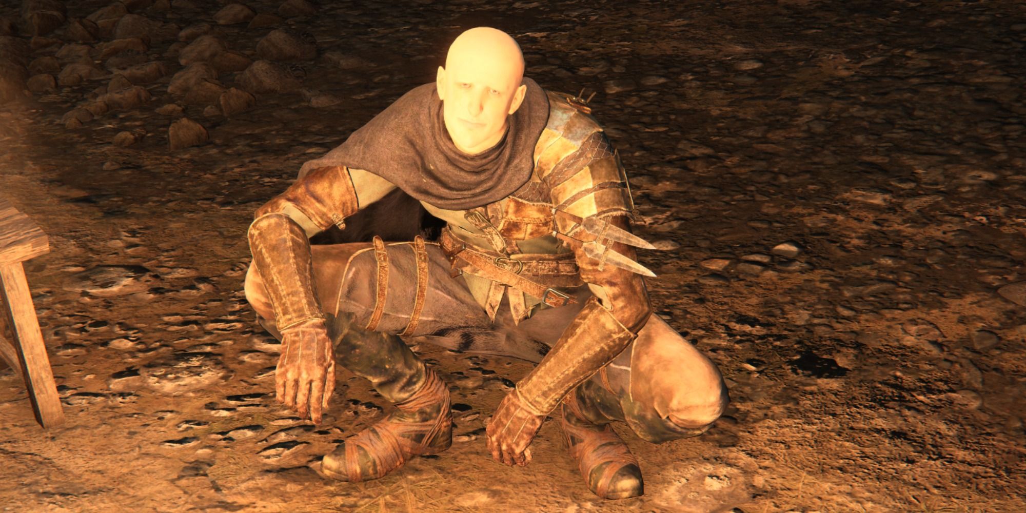 Patches squatting by a fire in Elden Ring.