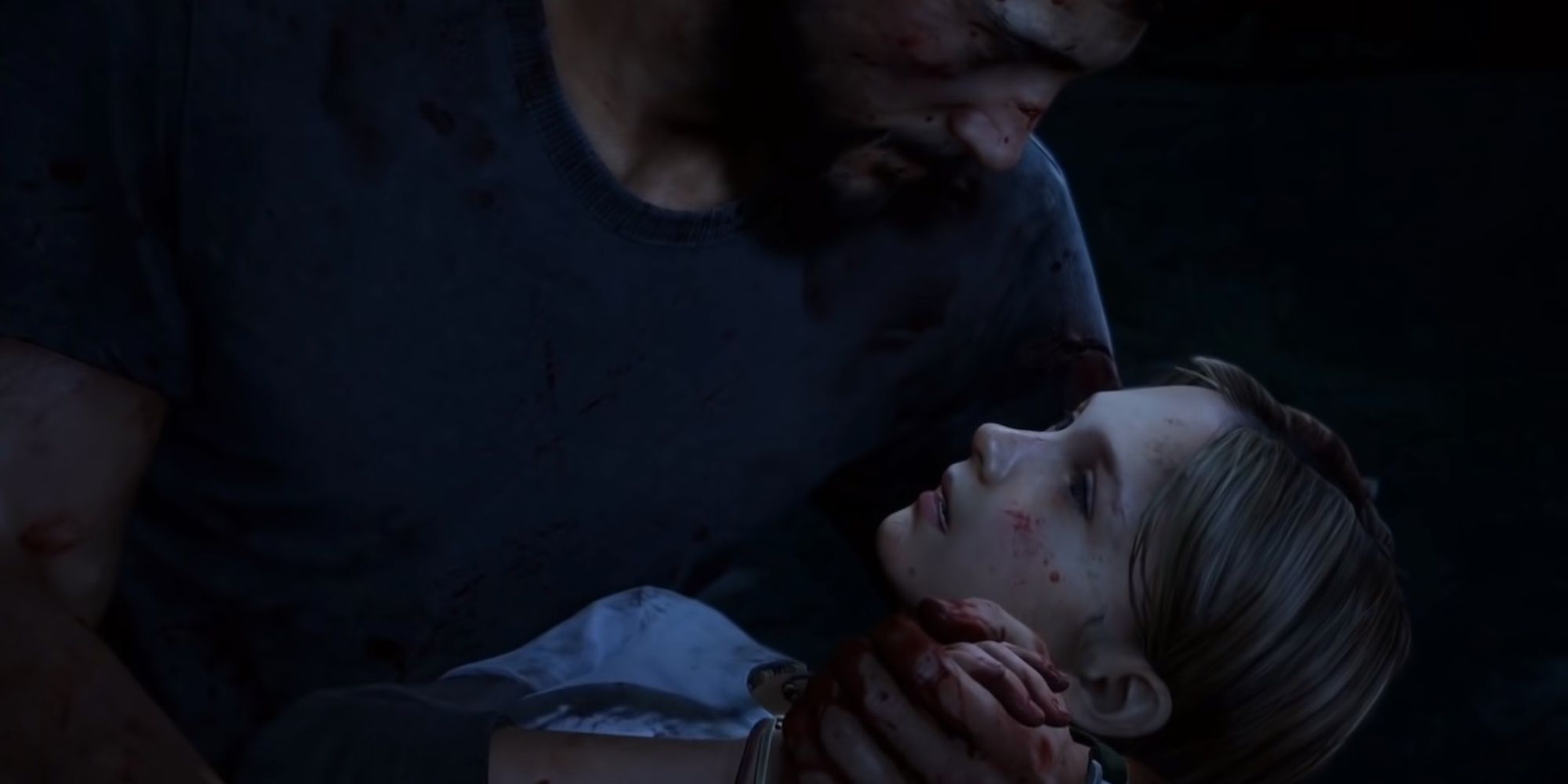 Joel holding Sarah as she dies, in The Last of Us
