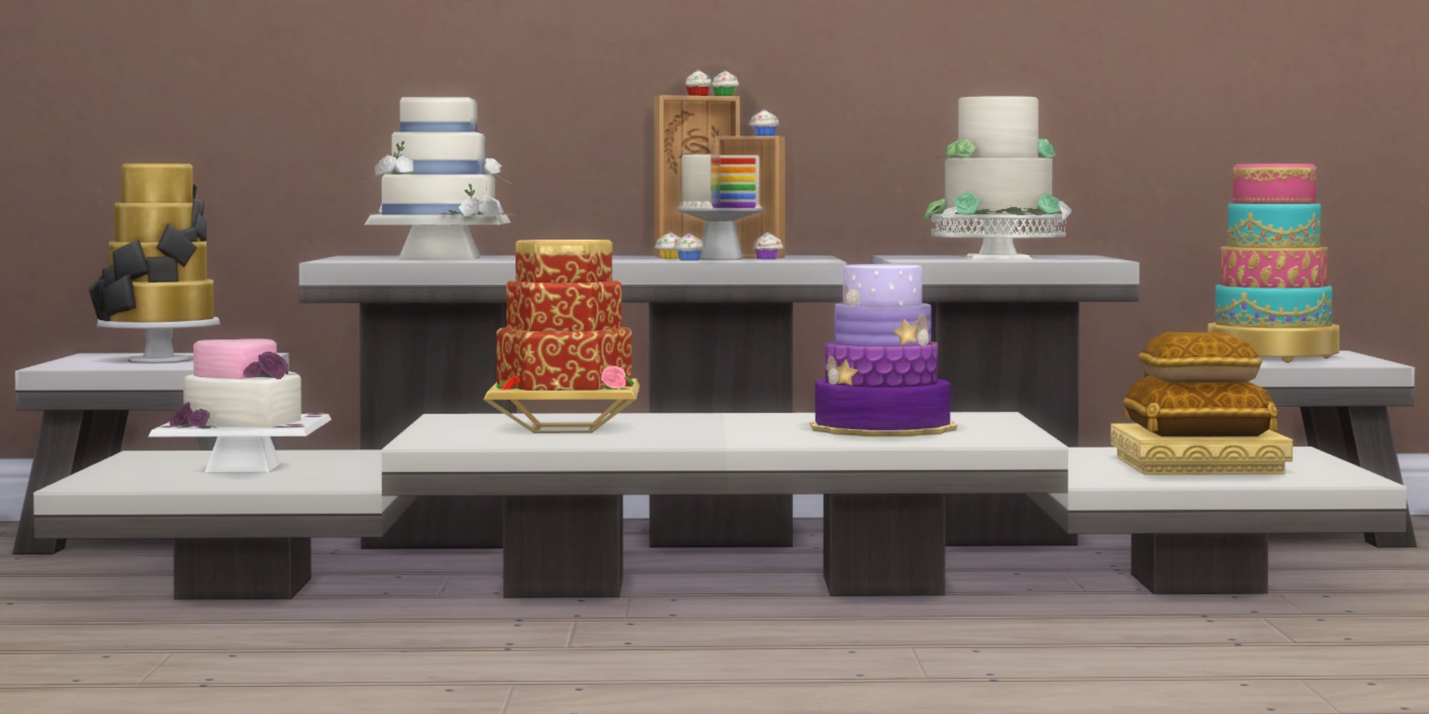 Sims 4 all wedding cake types on plynths in front of a wall