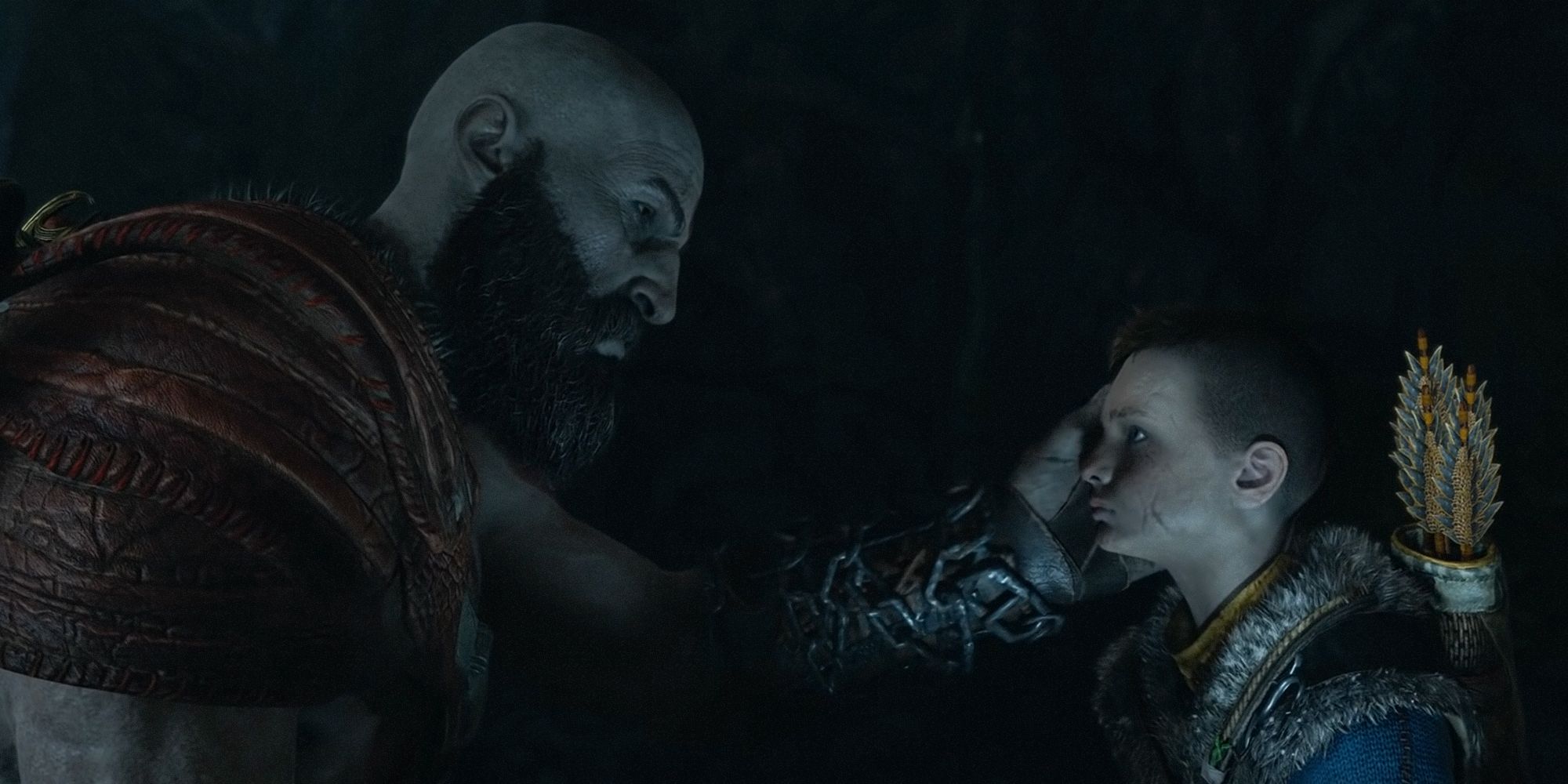 God Of War 2018 Kratos holding Atreus' face in his hands.