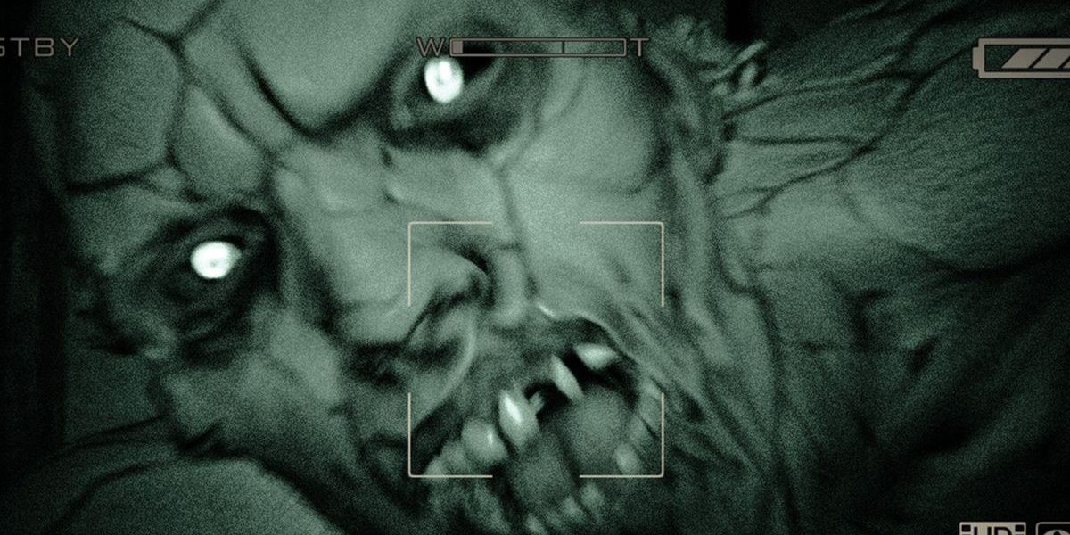 A close-up night vision camera attack of a character in Outlast