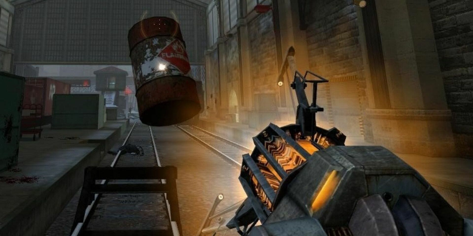 A screenshot showing the gravity gun being used to manipulate an explosive barrel in Half-Life 2