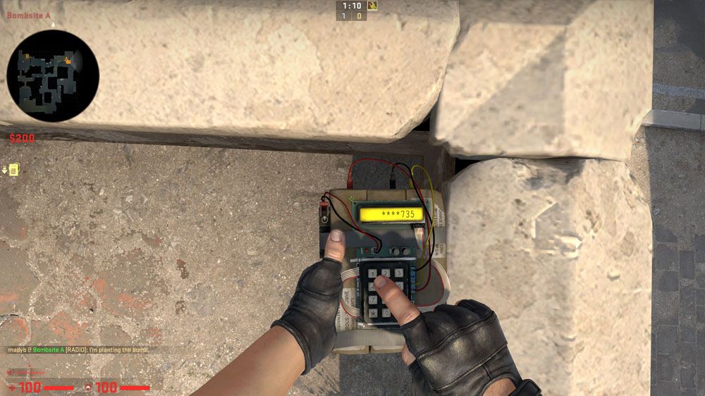 A Terrorist in CS:GO is planting the C4 to win the round