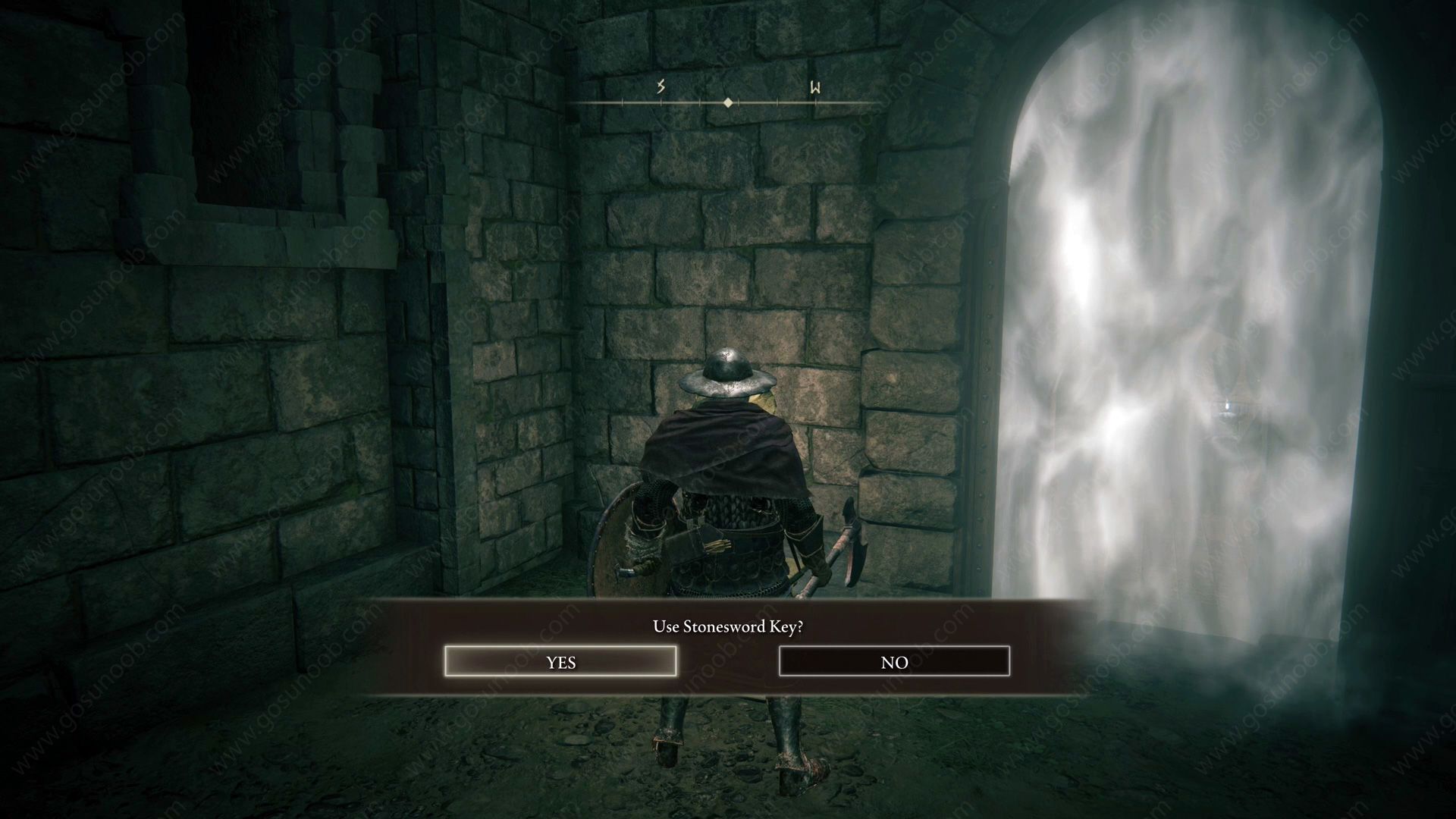 Screenshot of Elden Ring's main character standing in front of a fog gate with prompt to use Stonesword Key