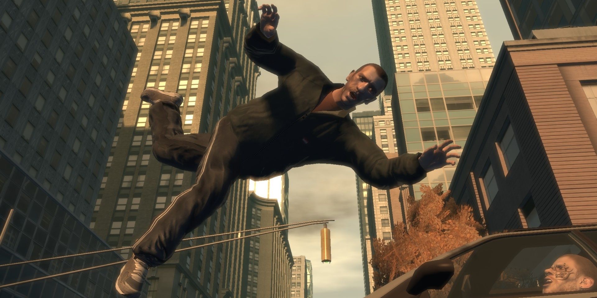 GTA 4 protagonist Niko Bellic flies through the air whilst looking at the camera