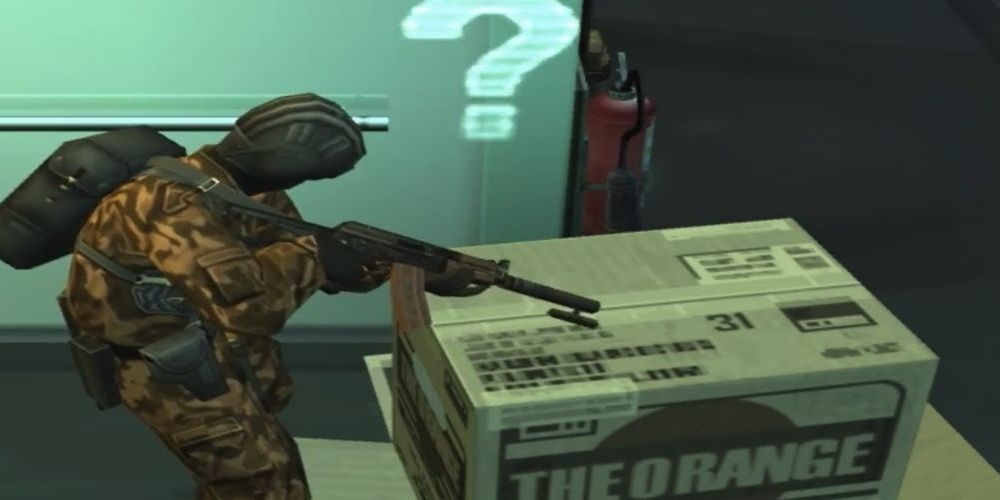Solid Snake hiding in a cardboard box in Metal Gear Solid