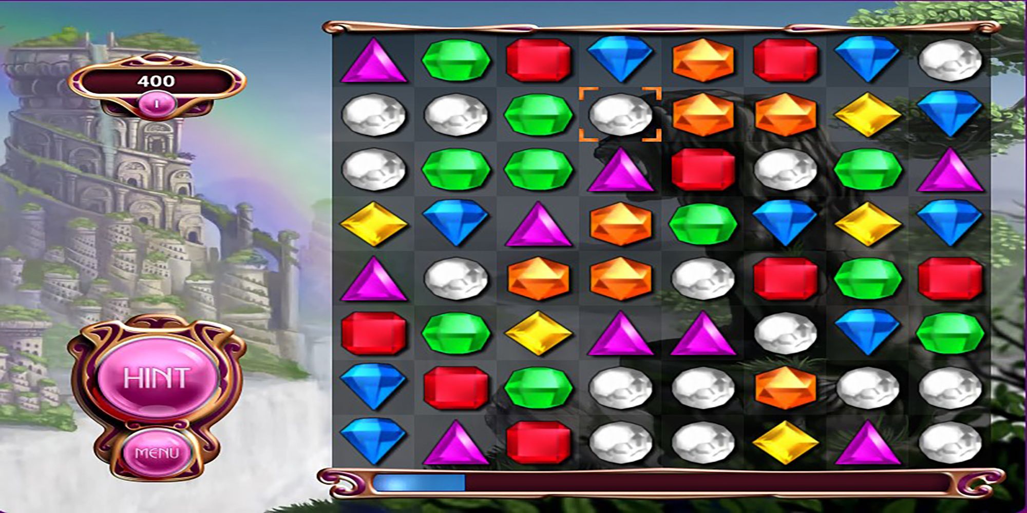 A grid of gems bely a mountain adored with fountains in Bejeweled 3 for PC.