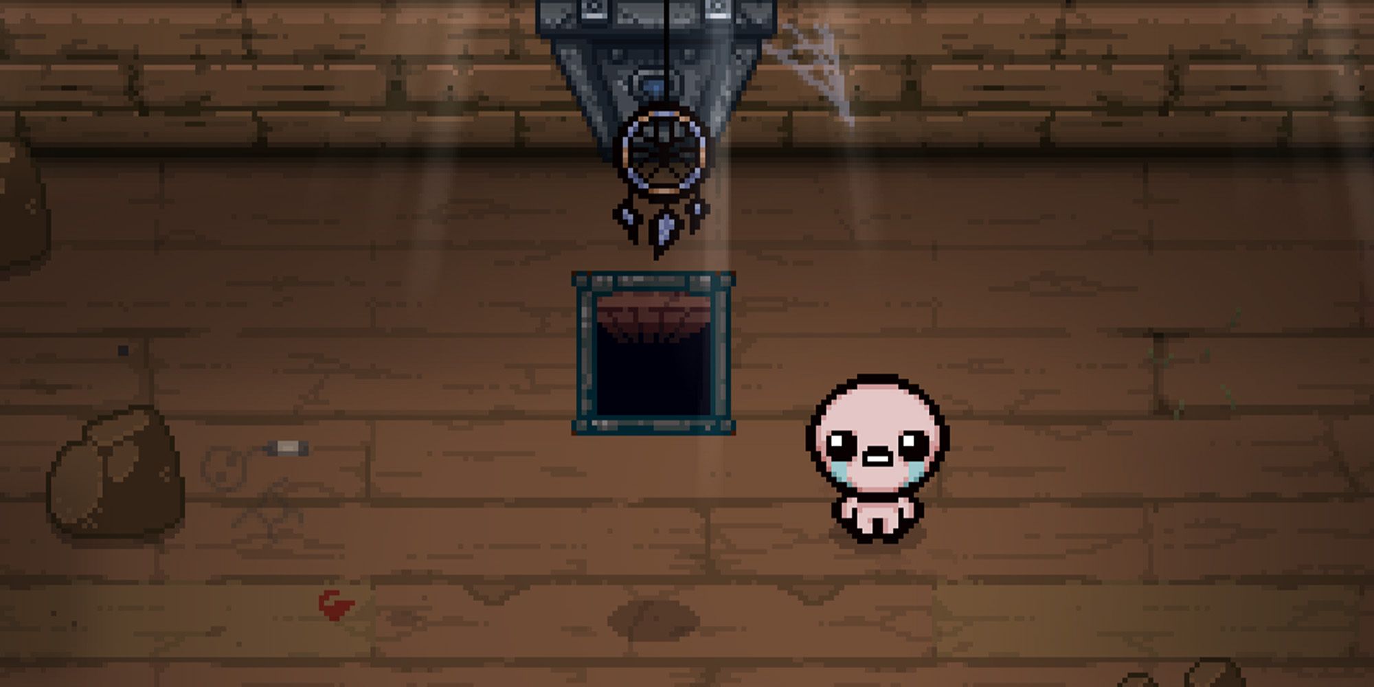 Binding of Isaac: Repentance screenshot, dream catcher hanging over trapdoor