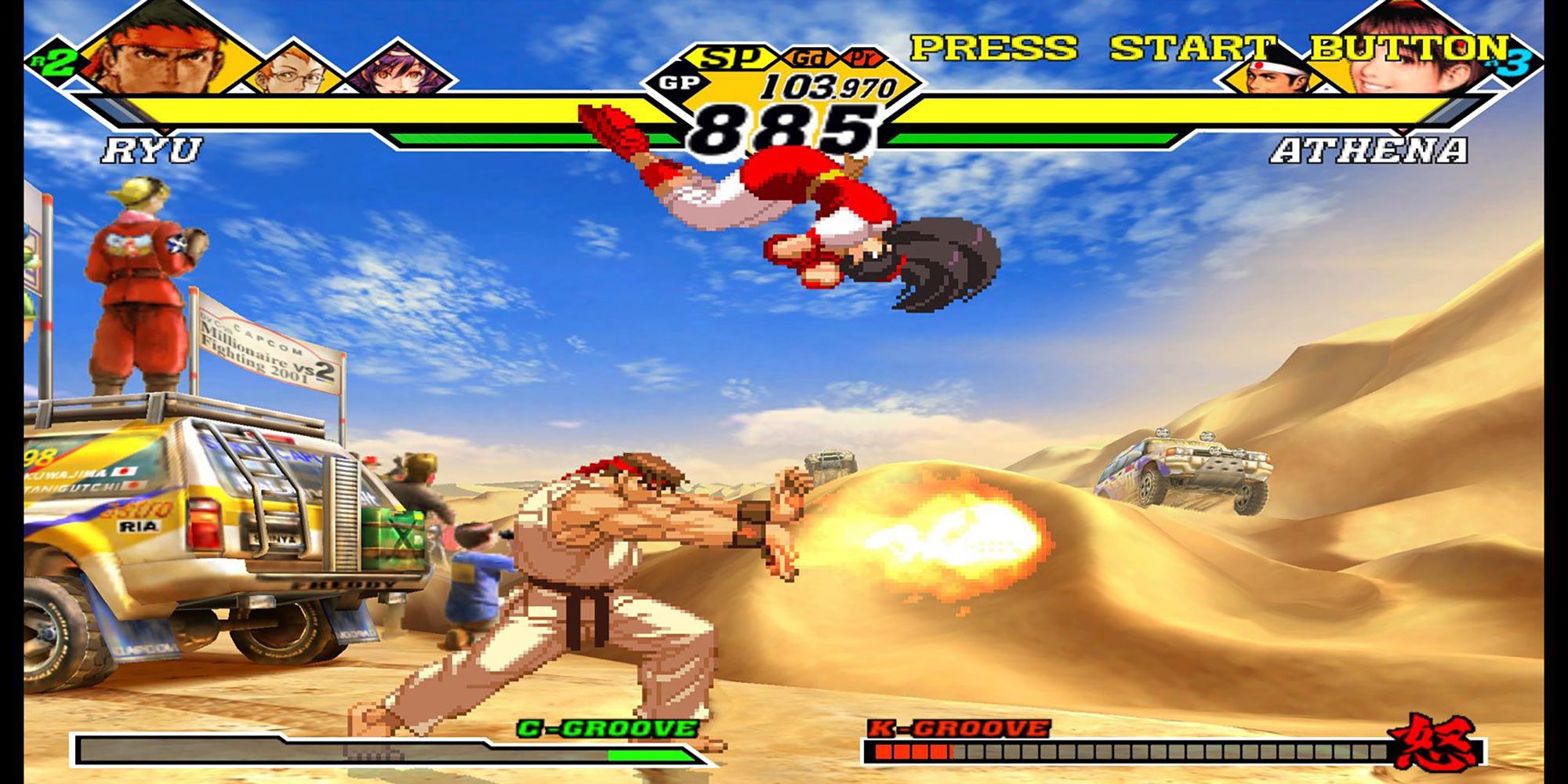 Athena dodges Ryu's hadoken in a battle in a desert in Capcom vs. SNK 2.
