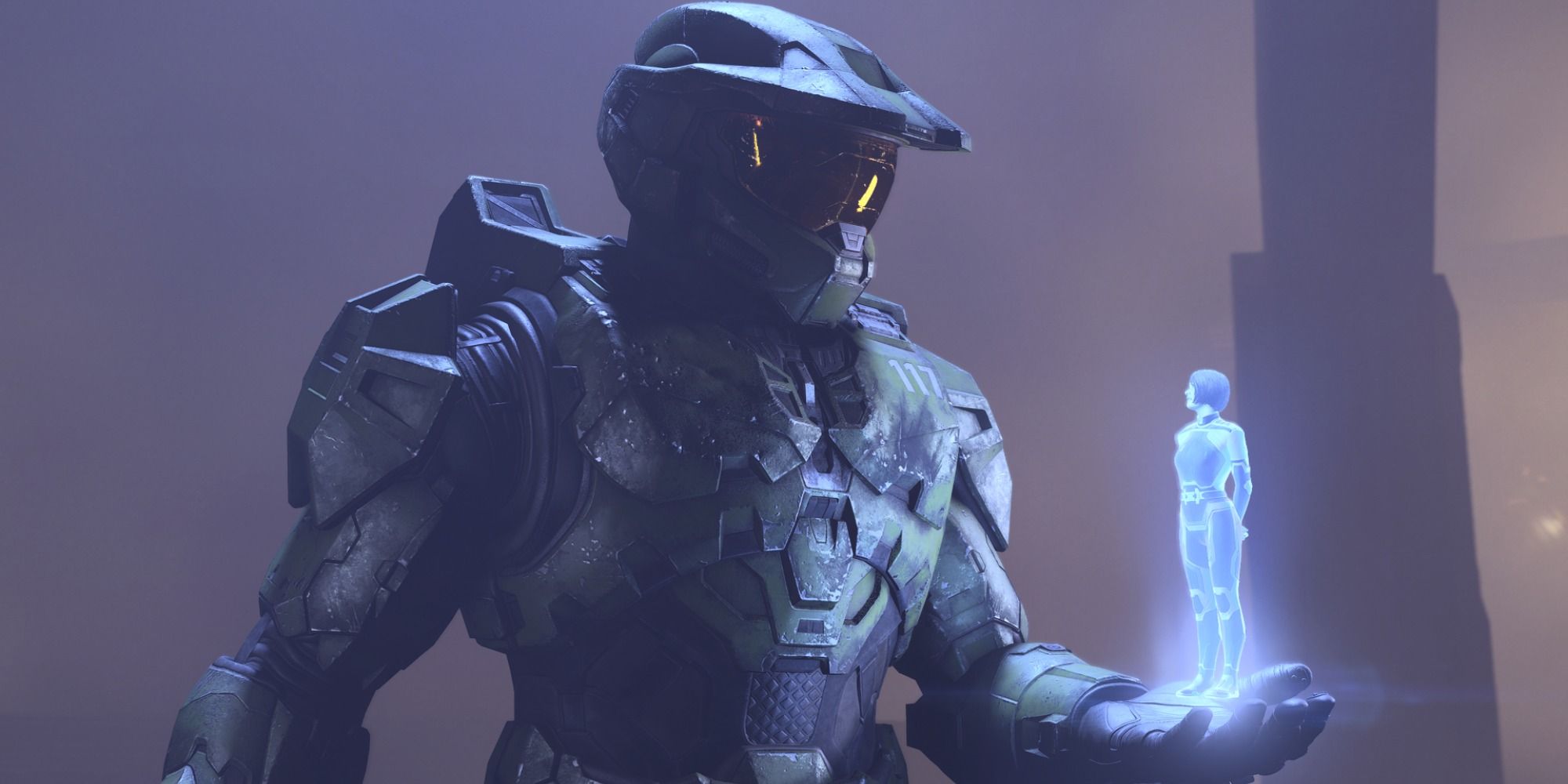 Master Chief holding Cortana's image in his hand