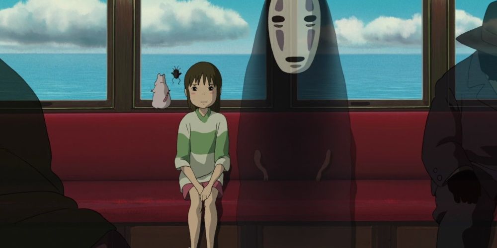 A screenshot of Chihiro sitting next to No Face on the train.