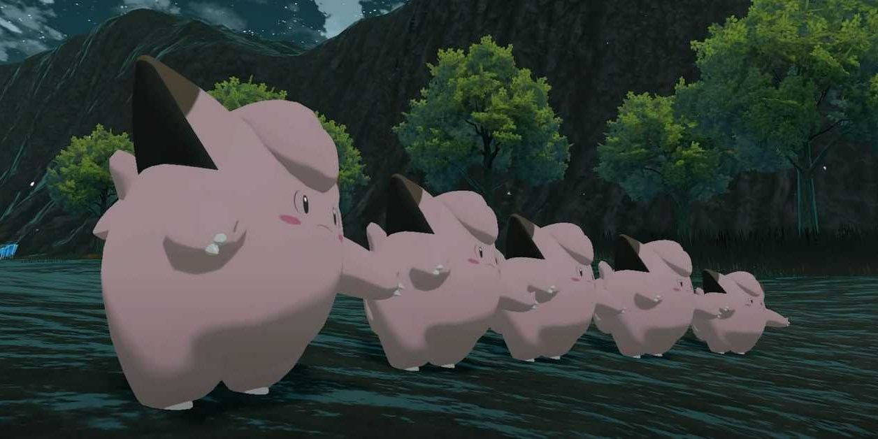 5 Clefairy standing in a line outdoors in a forest