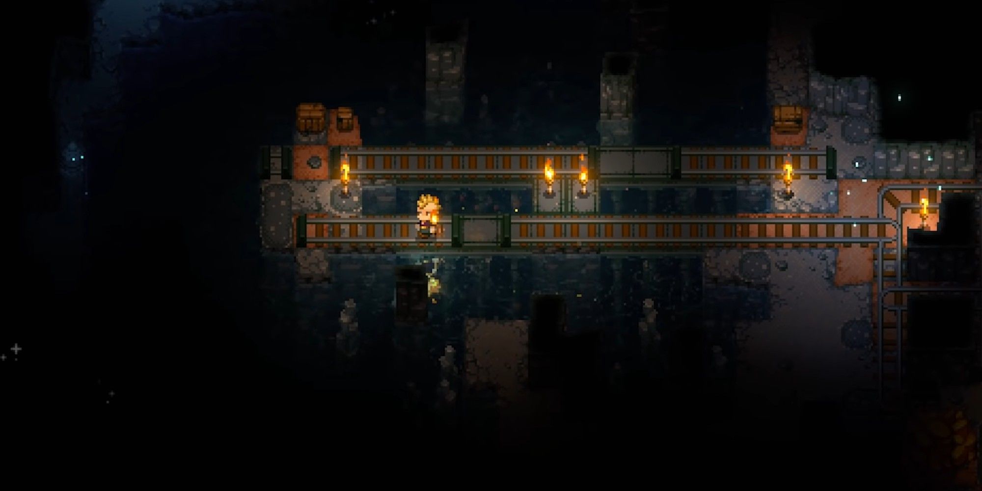 Railcars and torches in the caves of Core Keeper