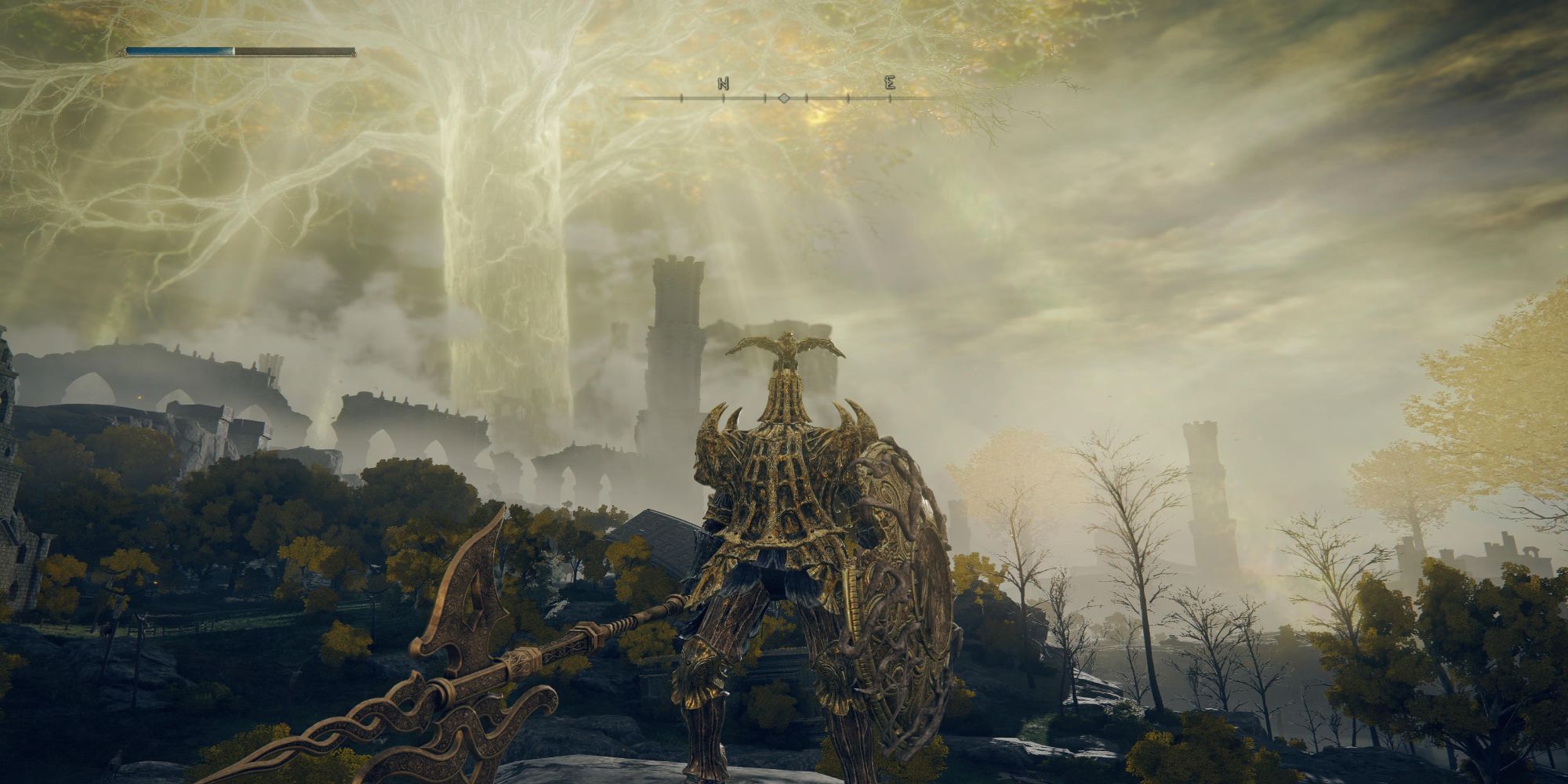 The Tarnished brandishes a Golden Halberd in front of the Erdtree in Elden Ring.