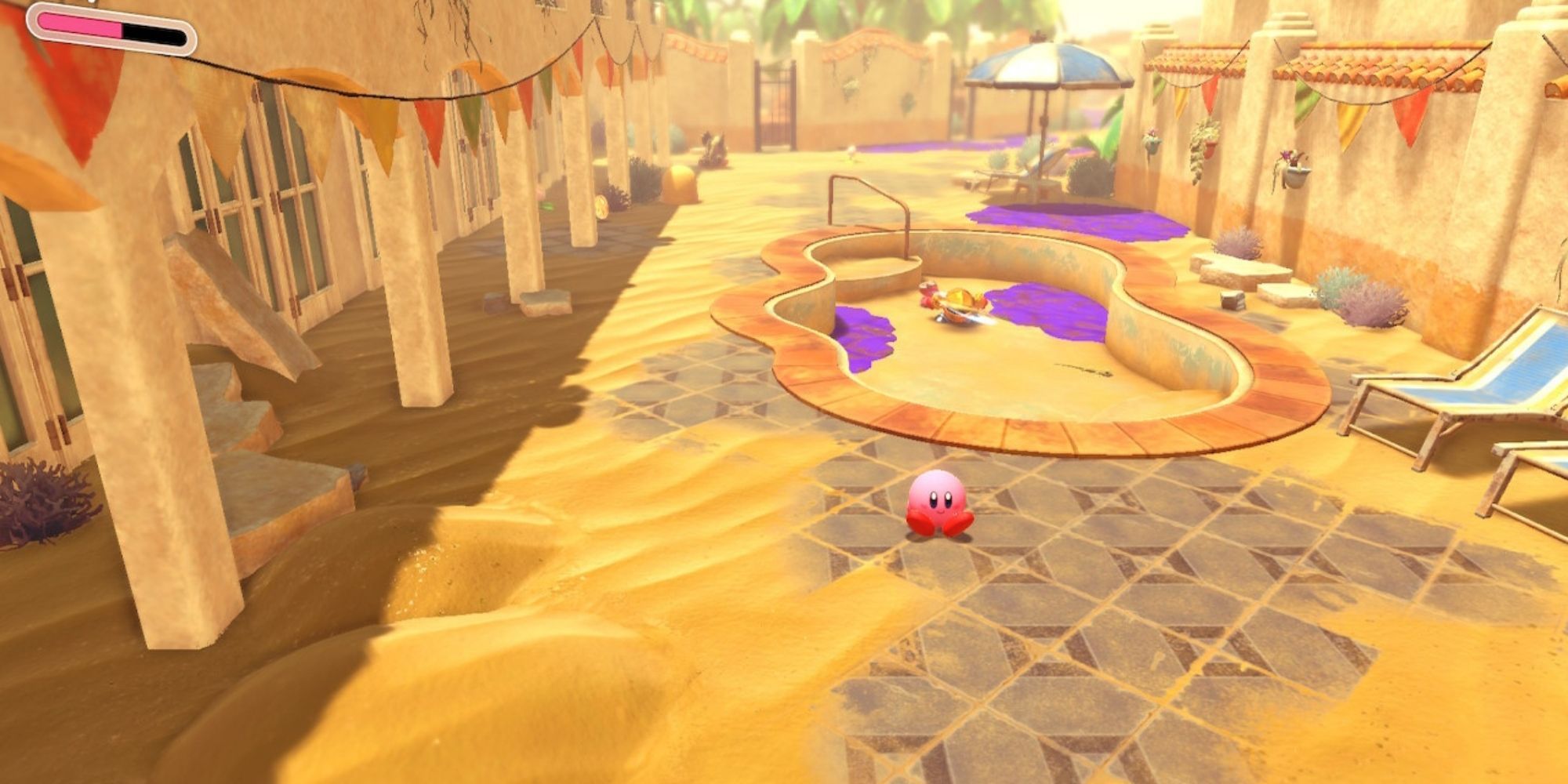 Kirby and the Forgotten Land Kirby Sits Down At The Start Of The Sandy Oasis