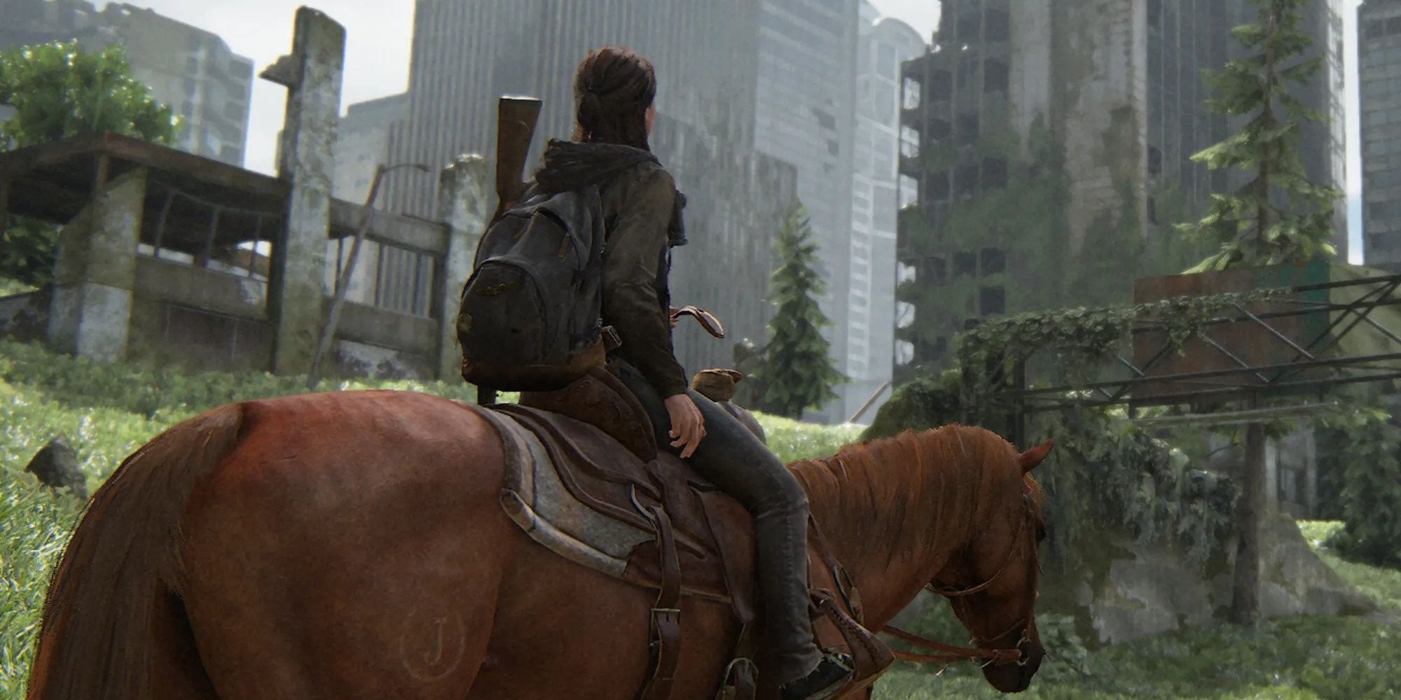 Ellie on horseback in front of Seattle in Last of Us Part 2