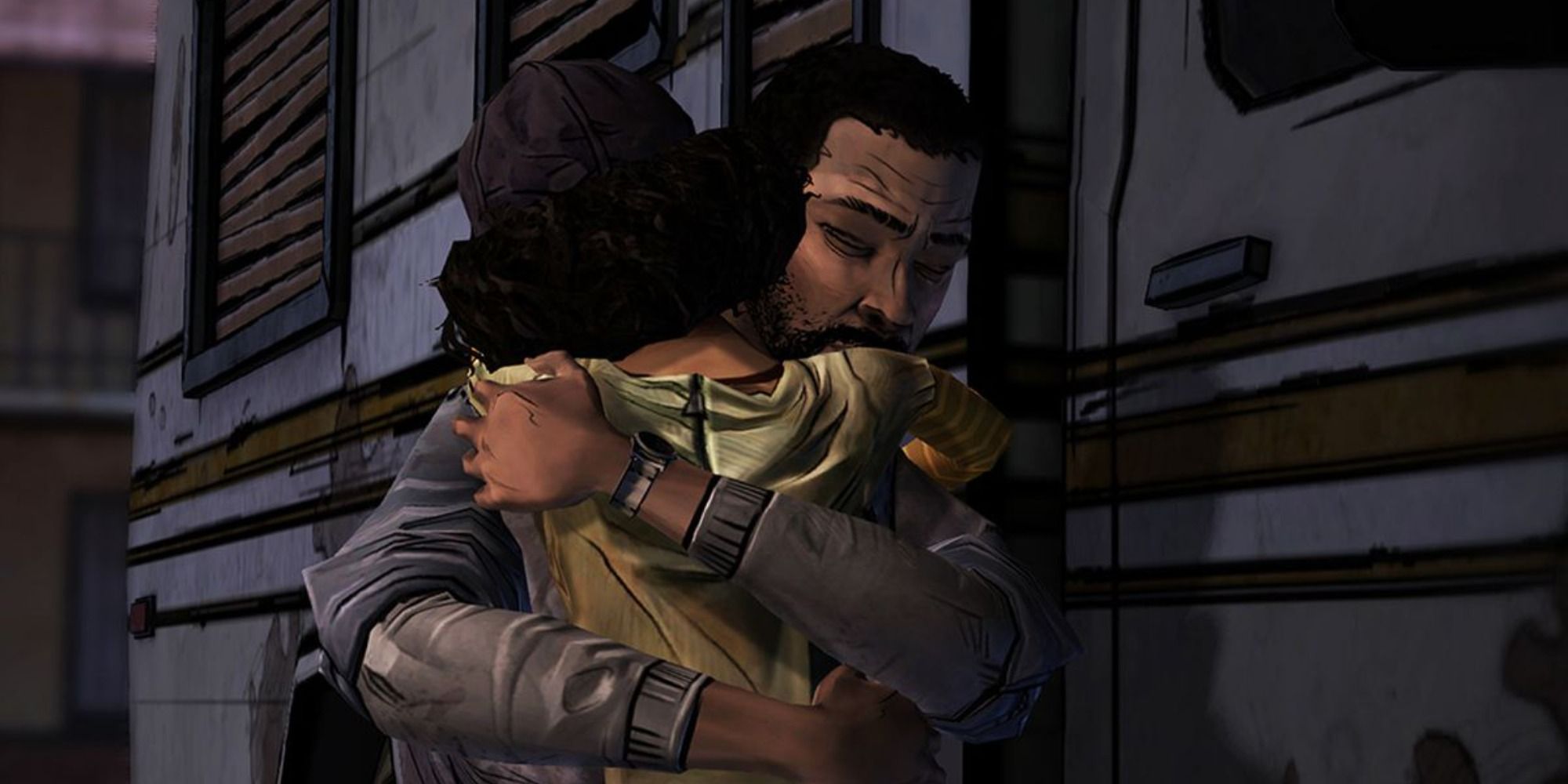 Lee & Clementine hugging in front of an RV