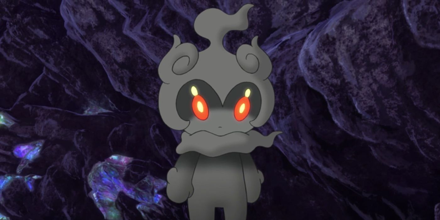 Marshadow looking expressionless in a dark cave.