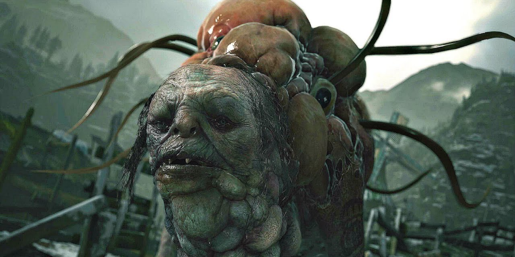 A mutated main, with eyes, pus sacks, and tentacles sprouting out of his body, looks closely at you while on a fishing dock.