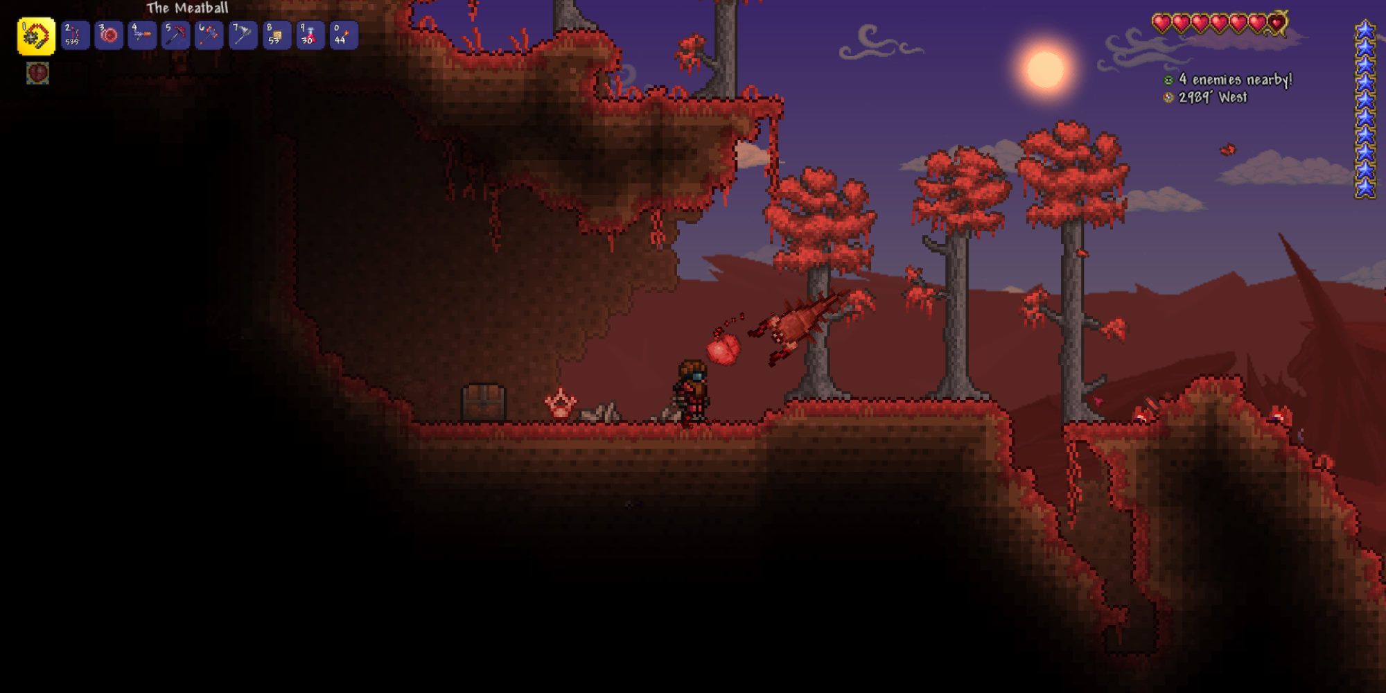 A player exploring Terraria's Crimson biome