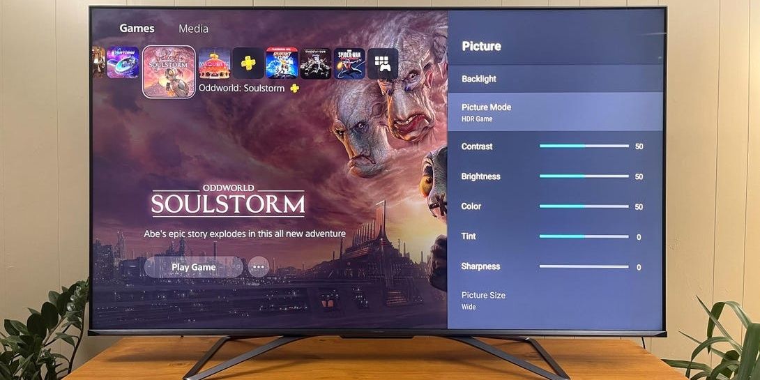 PS5 home screen with Oddworld: Soulstorm art and TV picture menu on Hisense U8G ULED Smart TV 