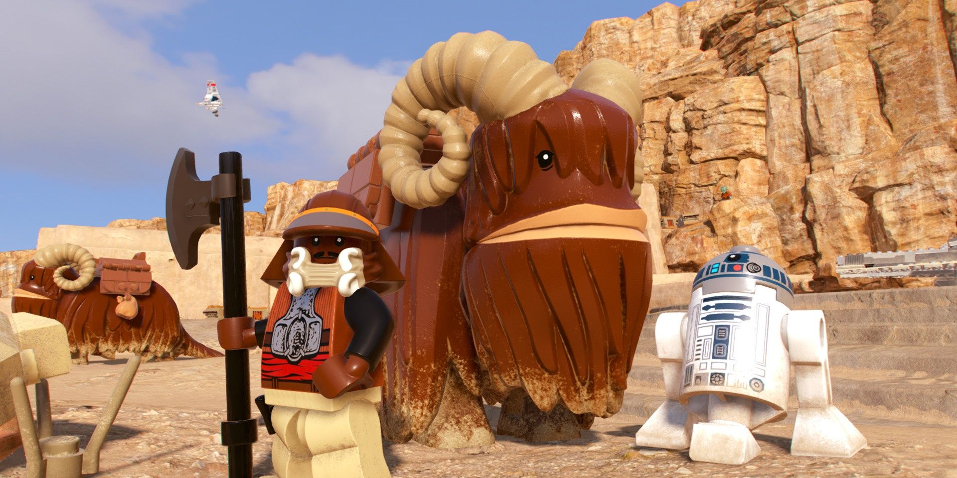 A screenshot showing Lando and R2-D2 in LEGO Star Wars: The Skywalker Saga