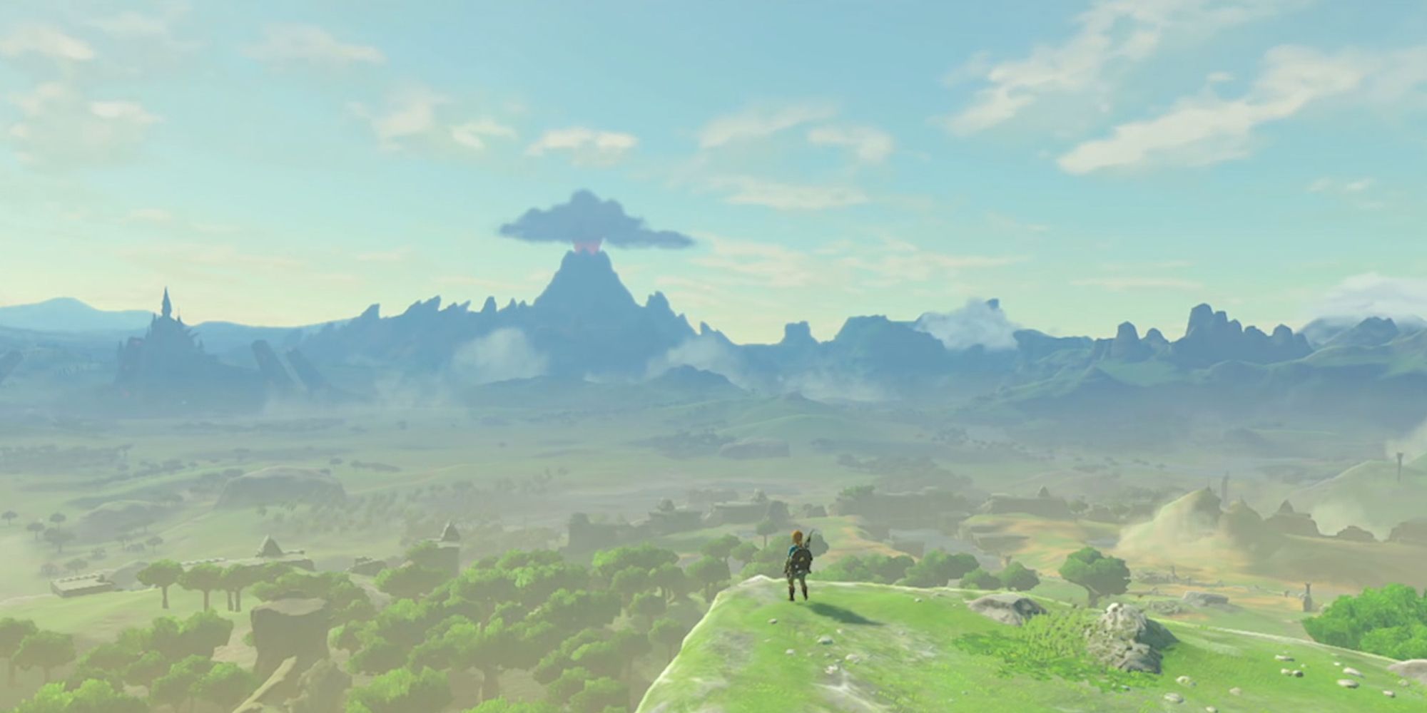Link Looks Out At Hyrule from a cliff, with Death Mountain looming in the distance