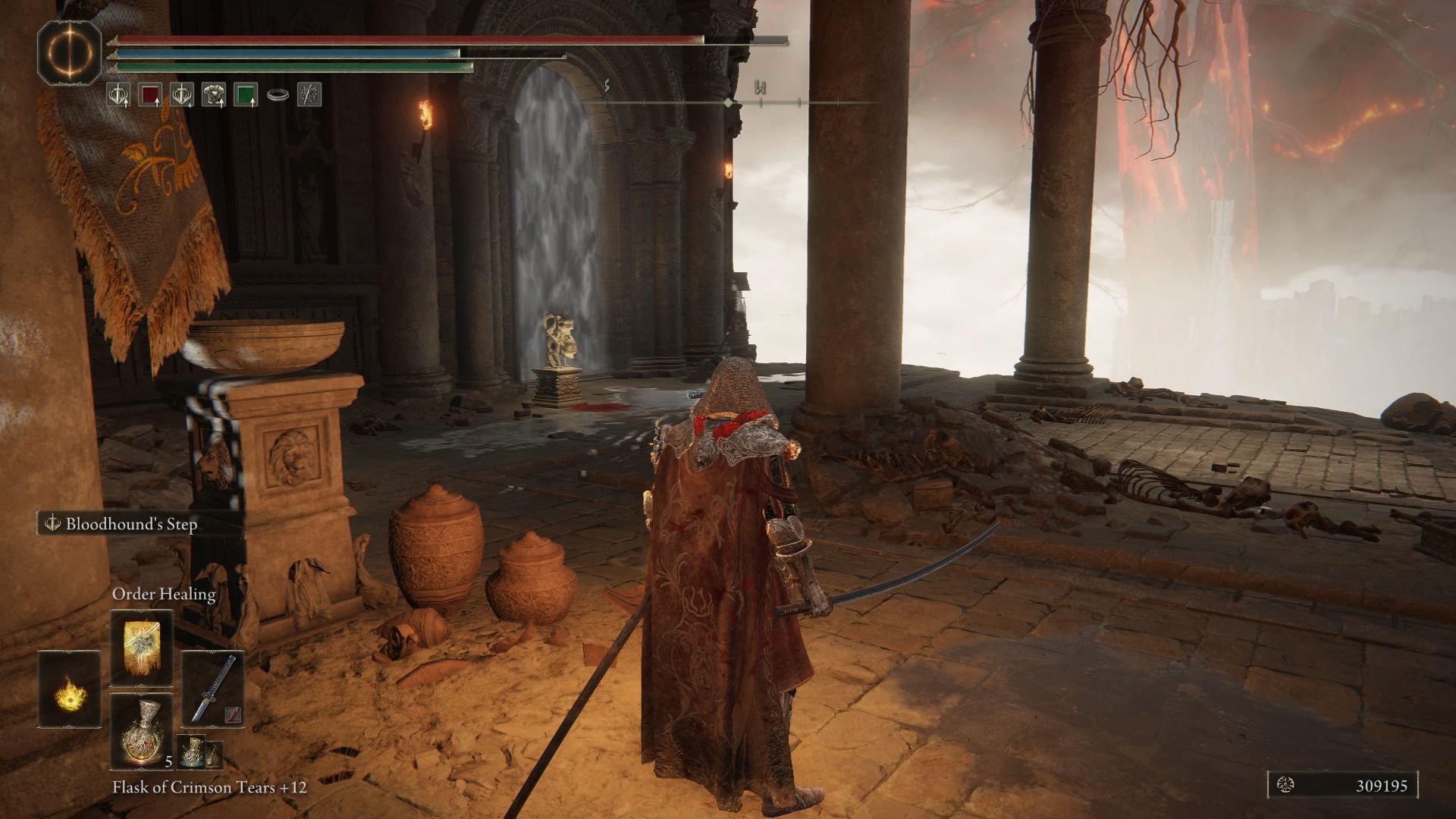 The player looking at the Imp Statue inside the building.
