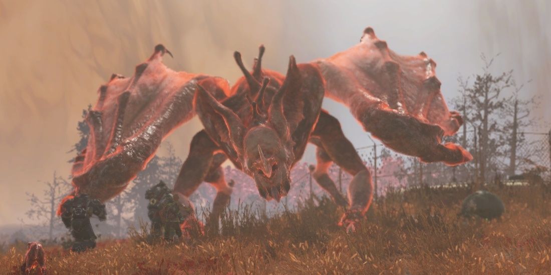 A Scorchbeast Queen from Fallout 76 stares down the player.