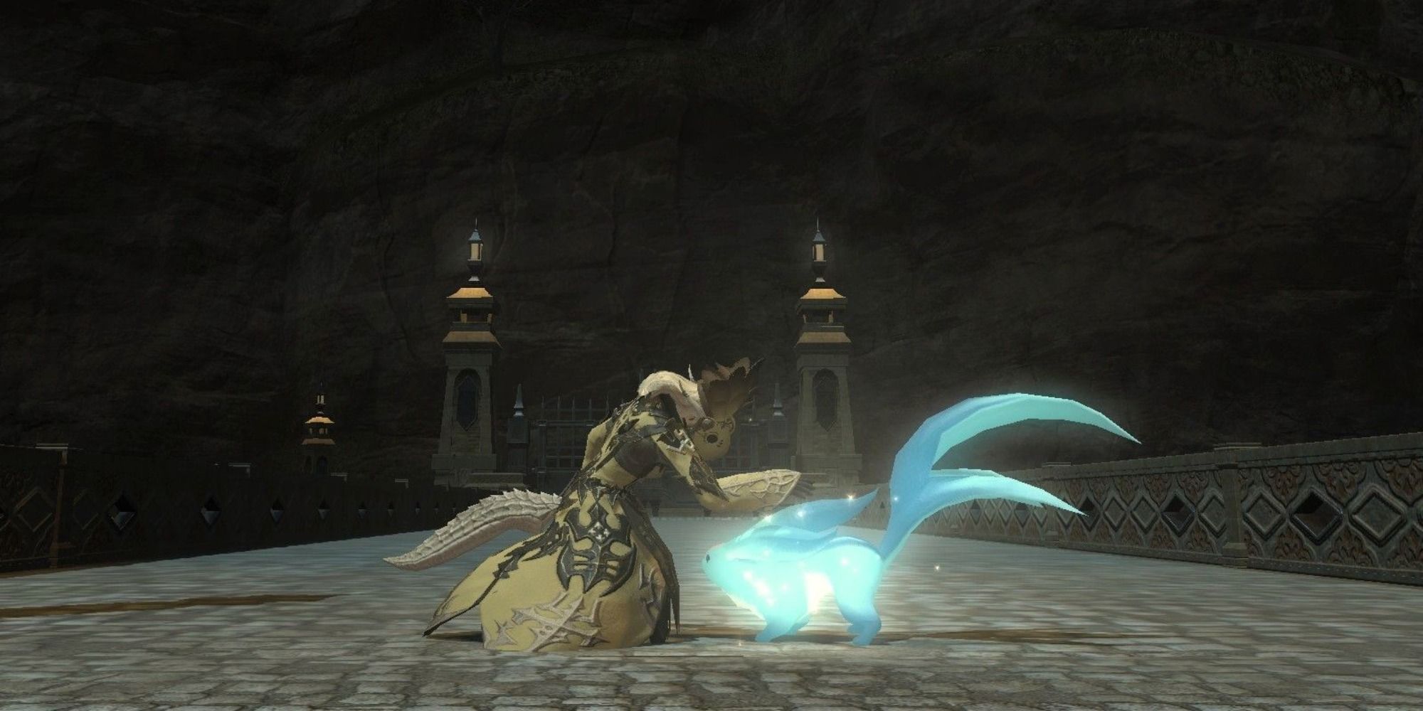 A Warrior of Light petting a Carbuncle in Final Fantasy 14