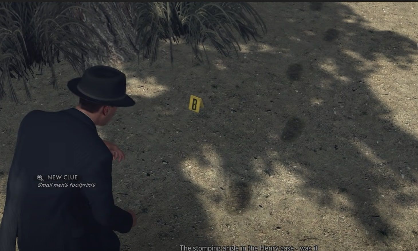 LA Noire Phelps inspects footprint clues