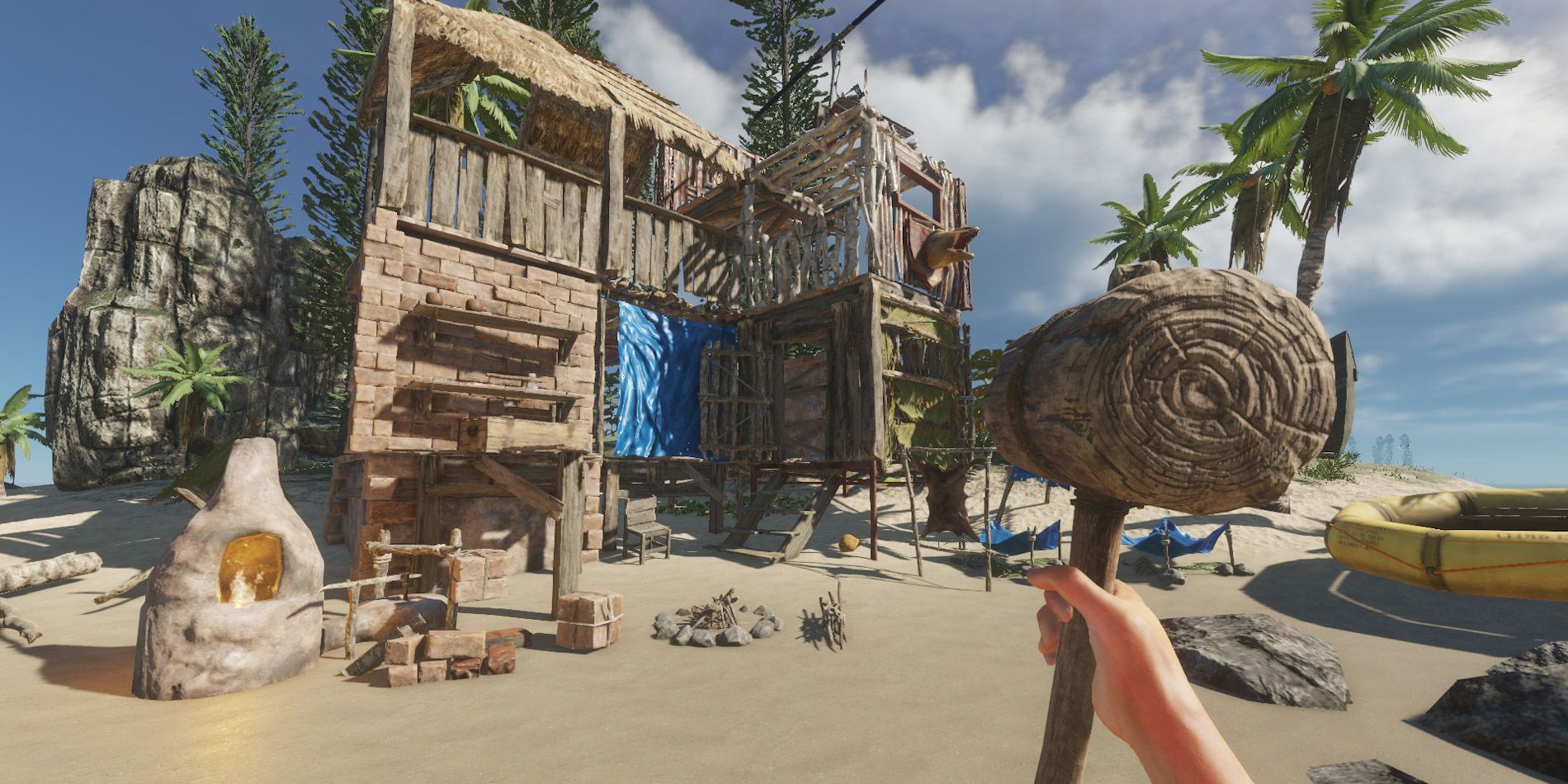 A player constructing a house on the beach in Stranded Deep.