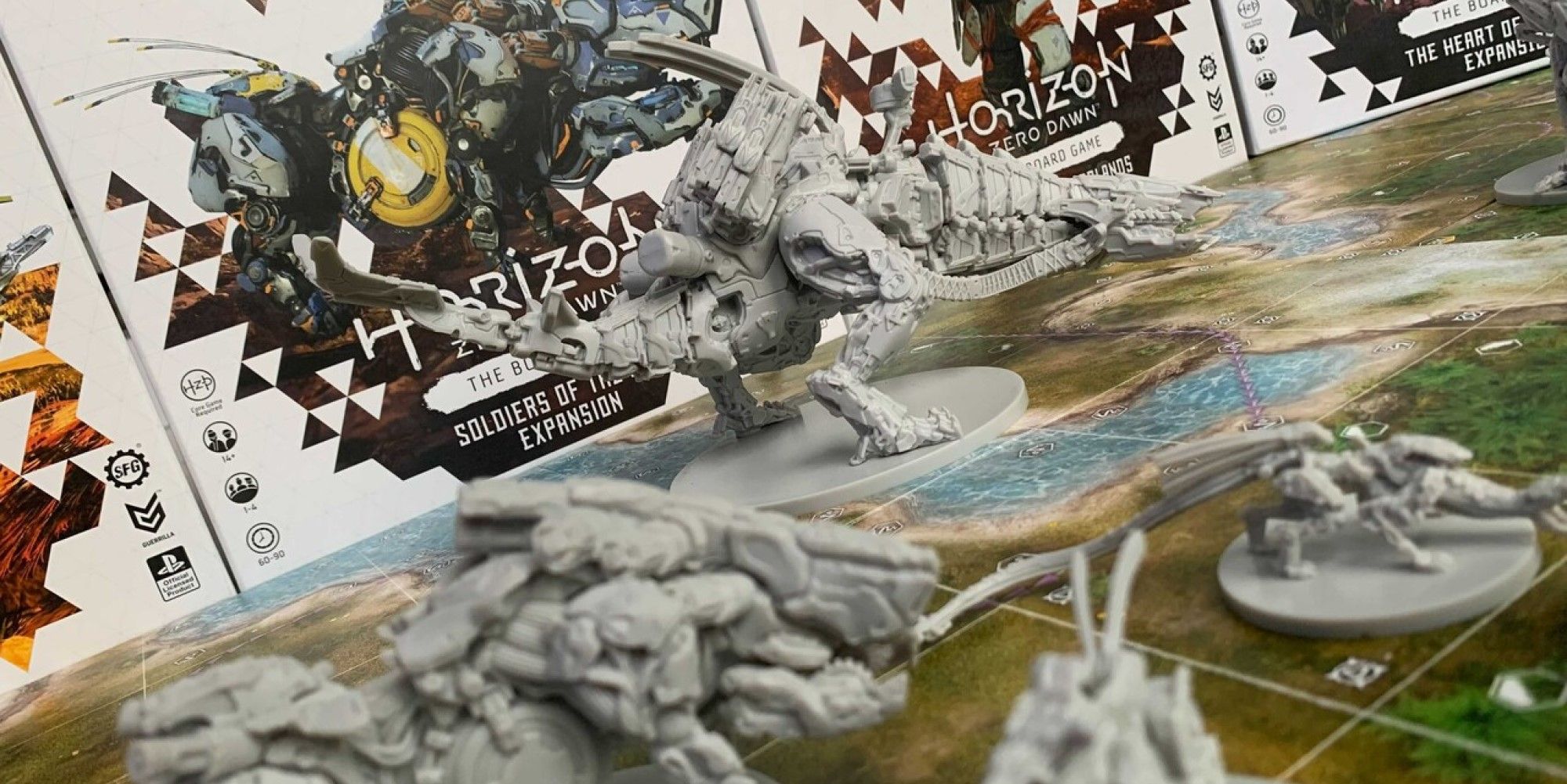 horizon zero dawn board game expansion boxes and thunderjaw piece