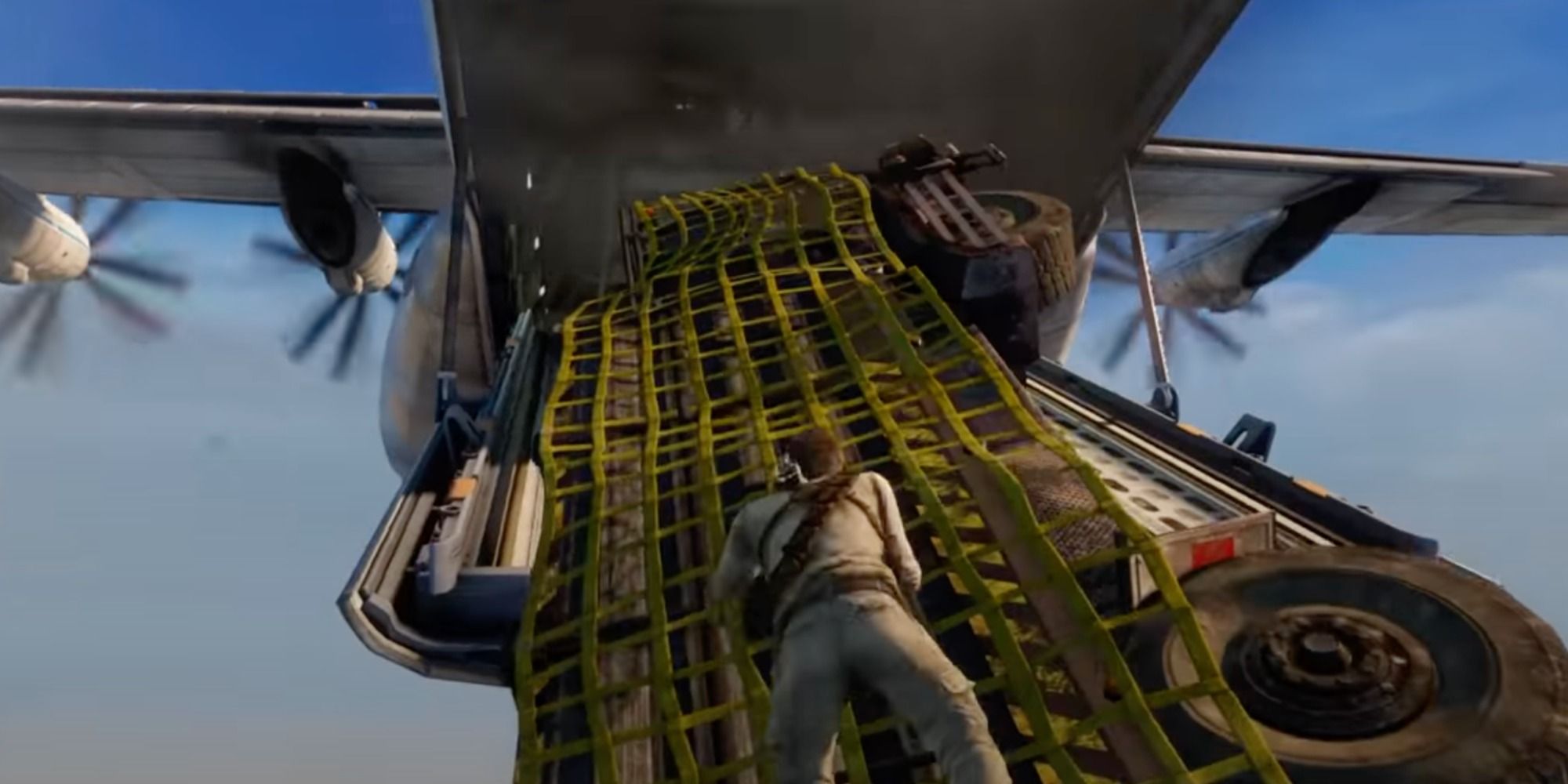 Nathan Drake climbing cargo on plane in mid air.
