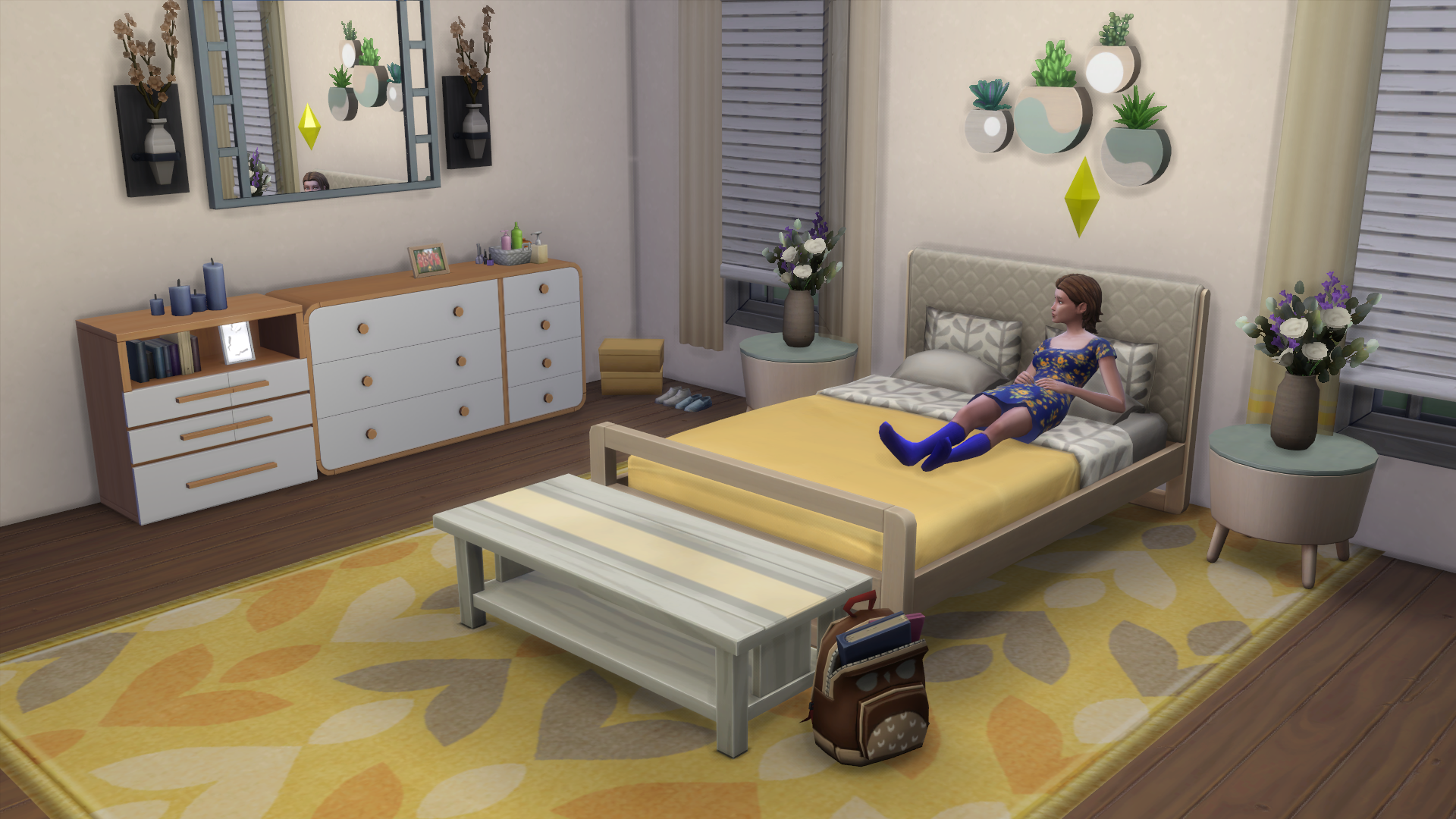 Sims 4 Bedroom themed in yellow and blue with a young adult Sim