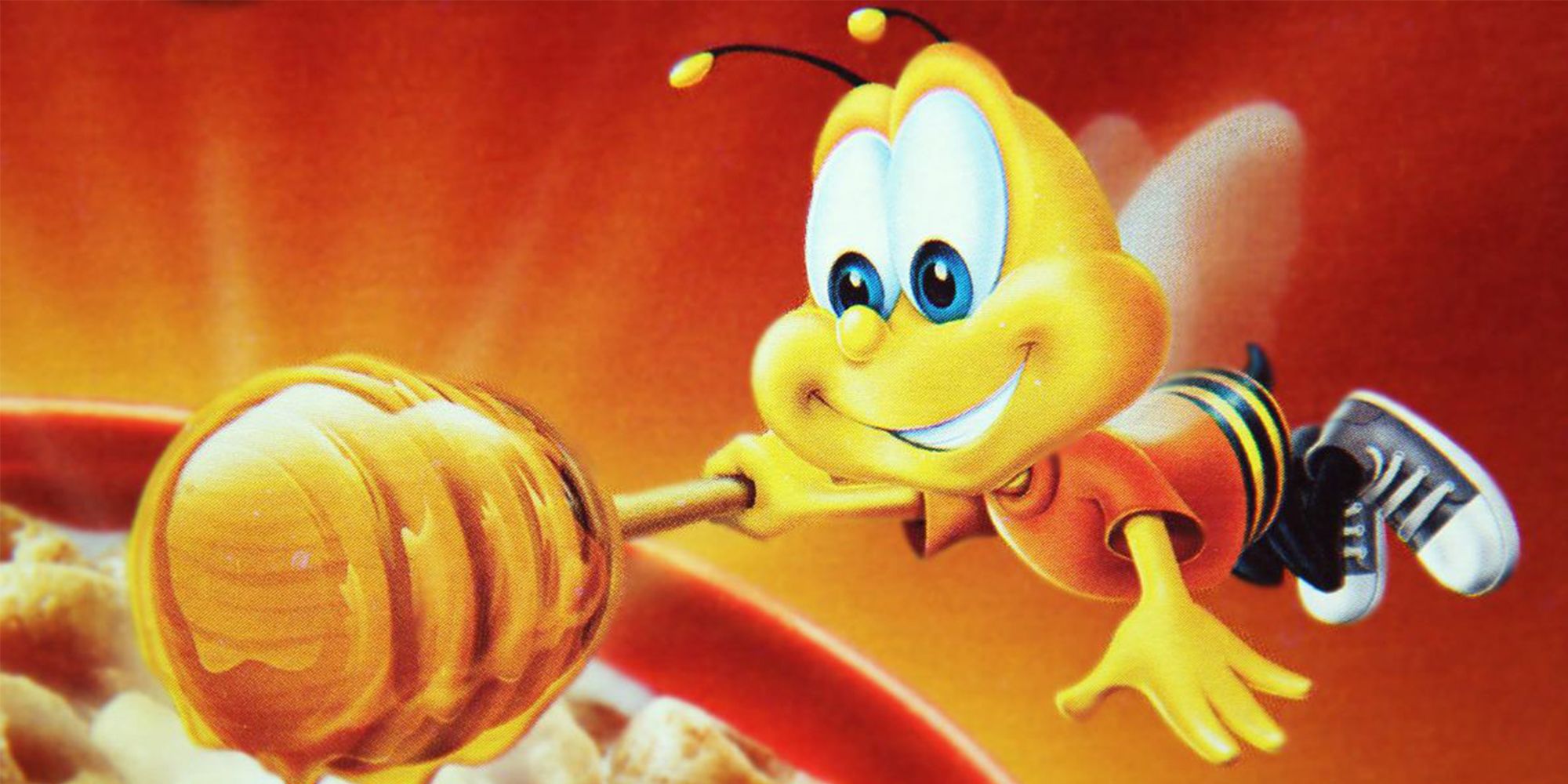 Buzz The Bee adds a dollop of honey onto a bowl of Honey Nut Cheerios.