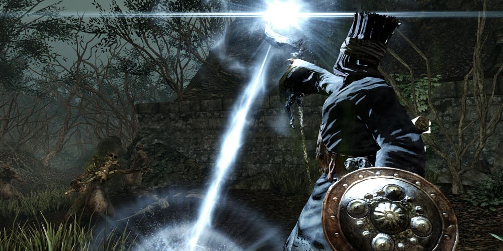 Dark Souls 2 player character holding a shield and casting a spell