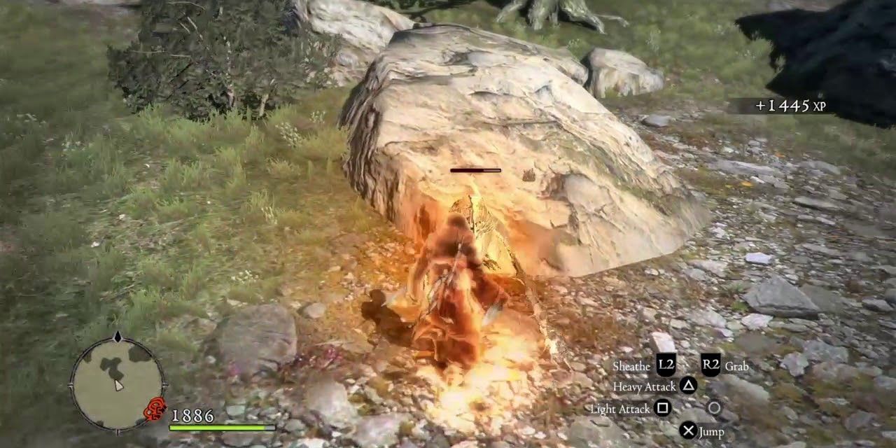 A character using Immolation outside stood beside a rock in Dragon's Dogma