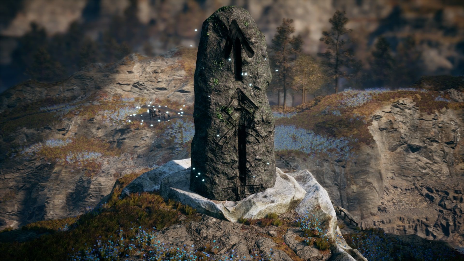 Frozenheim Runstone standing on the edge of a mountain