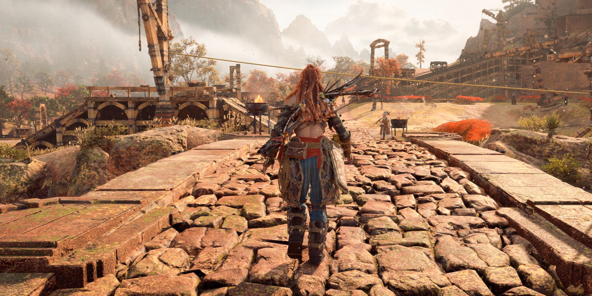 Horizon Forbidden West Aloy walking along a bridge.