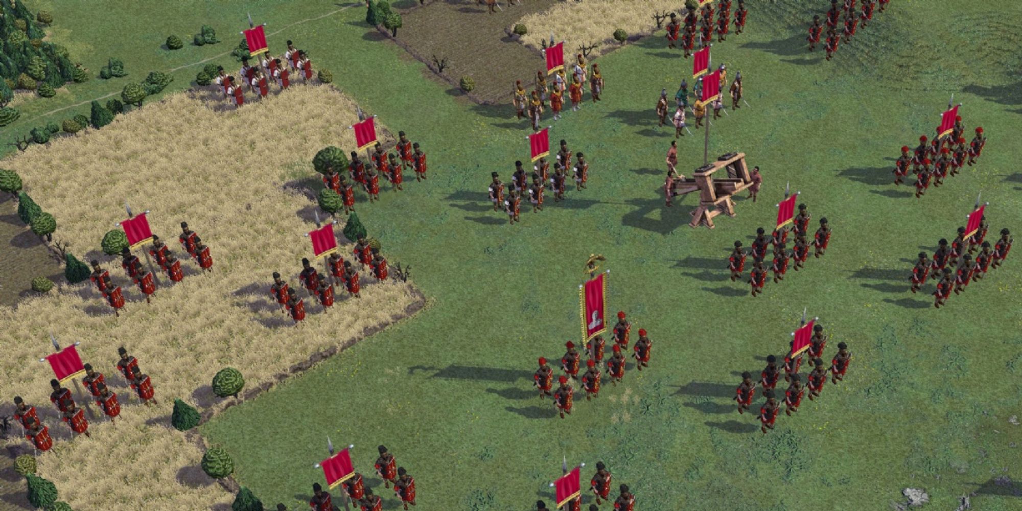 a wide overhead shot from Field of Glory 2 featuring a large Roman army gathered on a grassy field