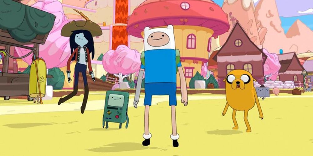 a mid shot of Marceline, BMO, Finn and Jake from Adventure Time stood in a line looking off into the distance in Candy Kingdom