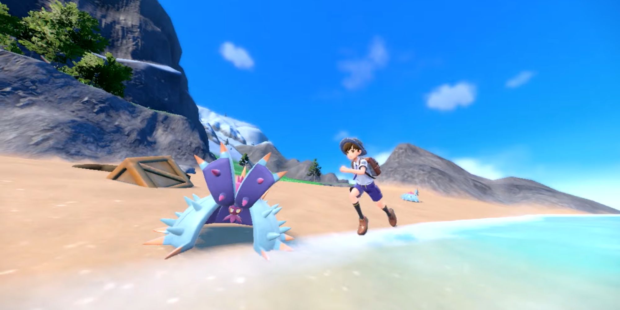 Pokemon S+V character running along a beach.