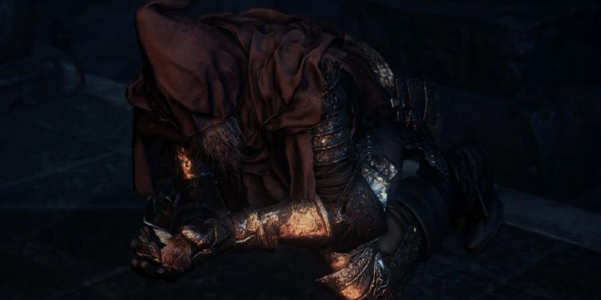 Slave Knight Gael praying in the chapel on his hands and knees