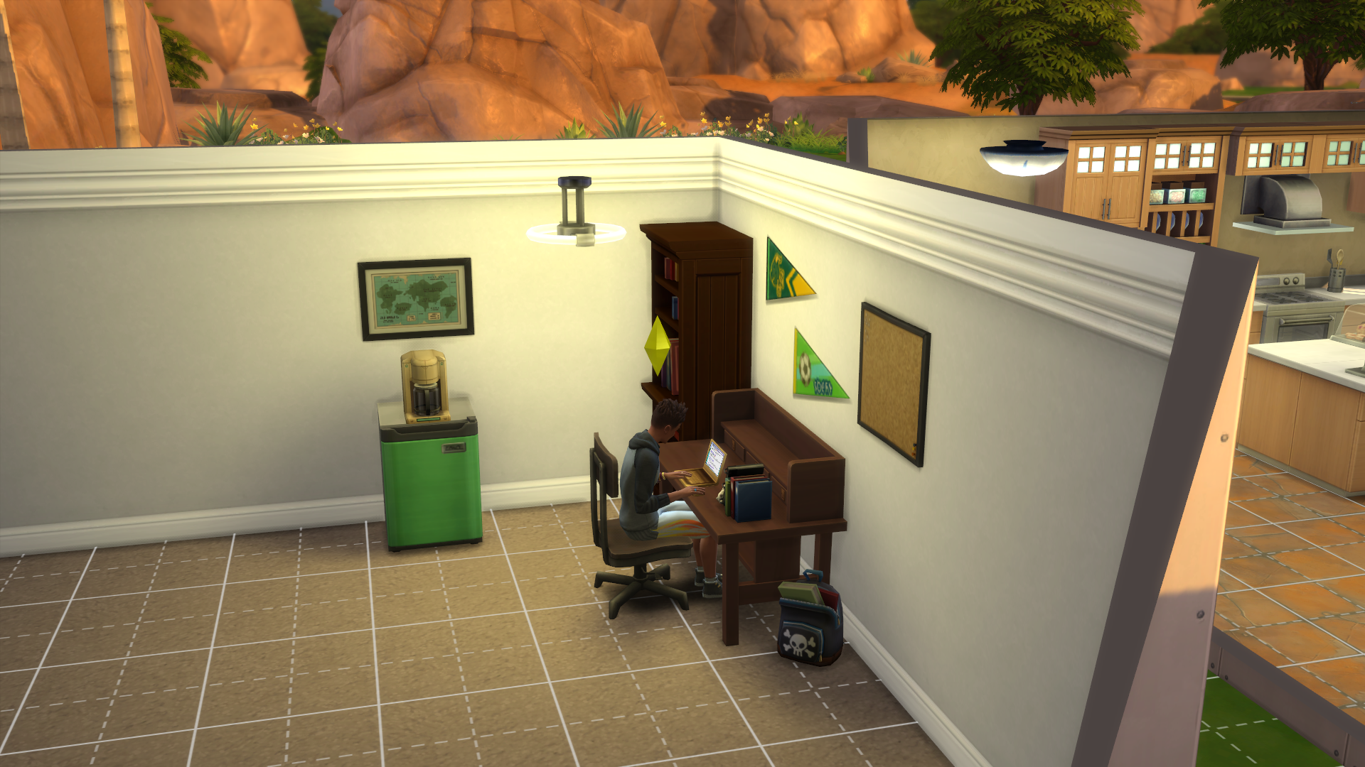 A Sim sitting at a study desk