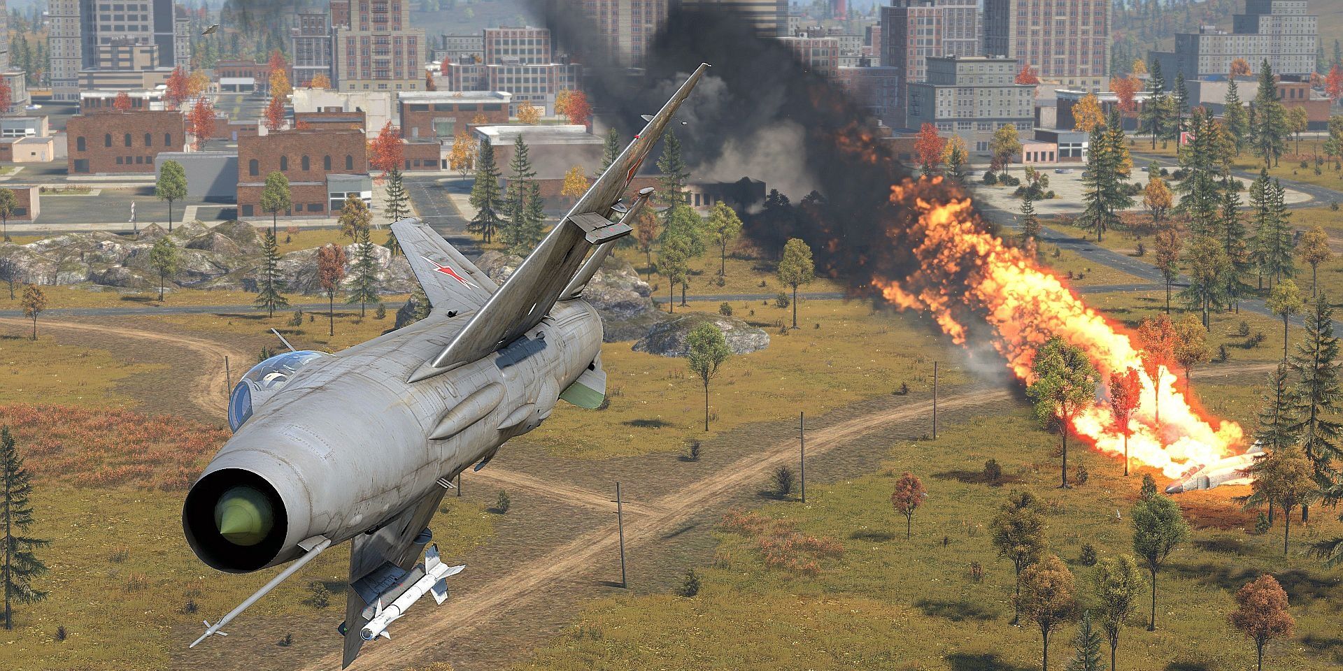 Plane flying away from an explosion near a city in War Thunder 