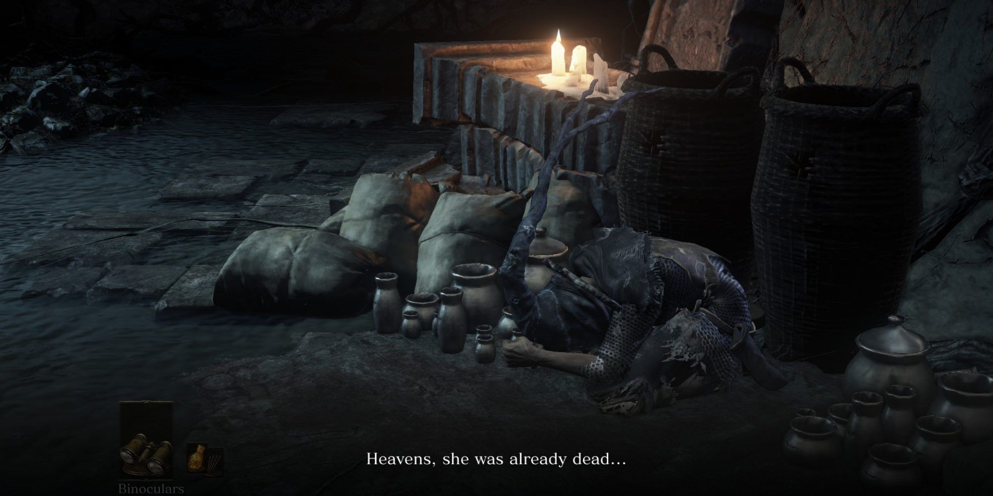Dark Souls 3 NPC Greirat curled up, mourning Loretta.