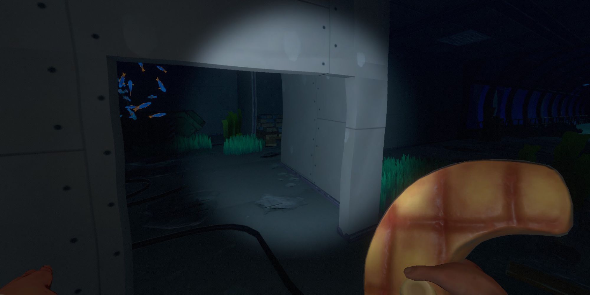 player holds onto cooked shark meat to eat while exploring sunked buildings underwater, a school of fish swim in the backroom
